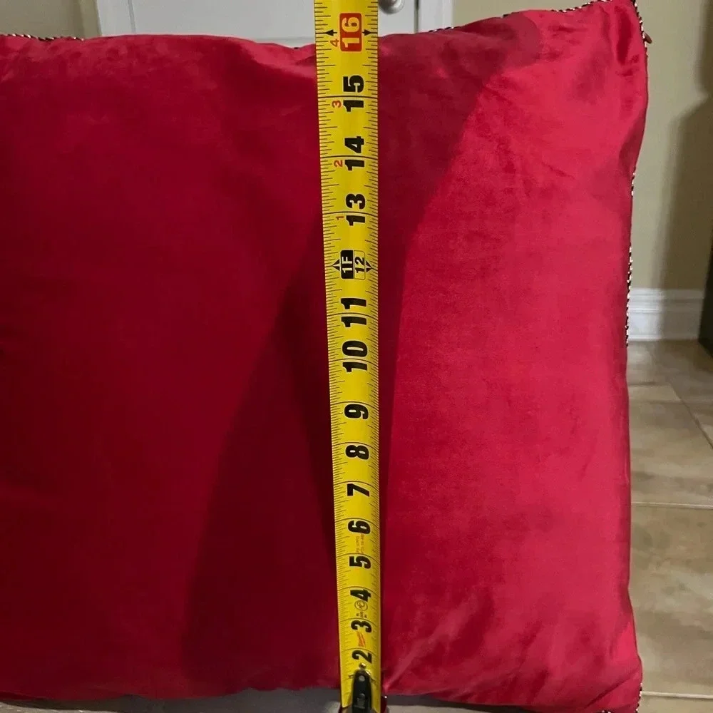 Set of 2 decorative red throw pillows with black/white stitching